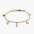 Seaside Anklet featuring seashell, blue and pink enamel seahorse, starfish, and pearl charms on a stainless steel chain.