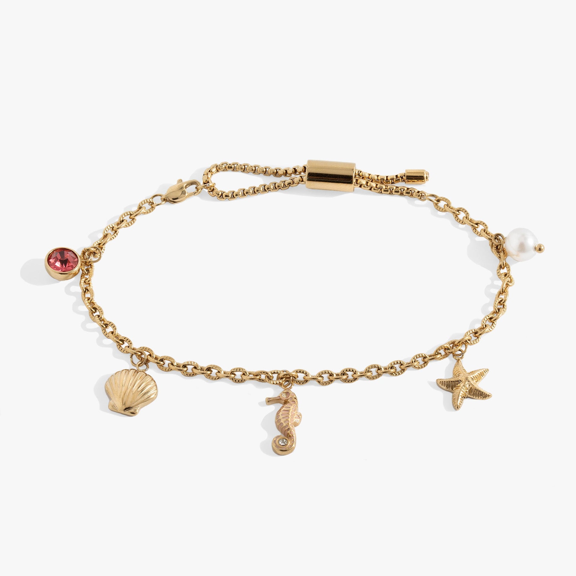 Seaside Anklet featuring seashell, blue and pink enamel seahorse, starfish, and pearl charms on a stainless steel chain.