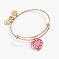 Alex And Ani gold-tone bangle featuring a pink epoxy Self Love Club heart charm
