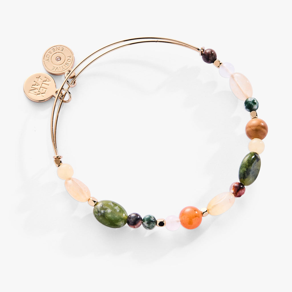 A multi-stone nugget gemstone bangle bracelet featuring Red Aventurine, Jasper, and Qing Hai Jade beads.