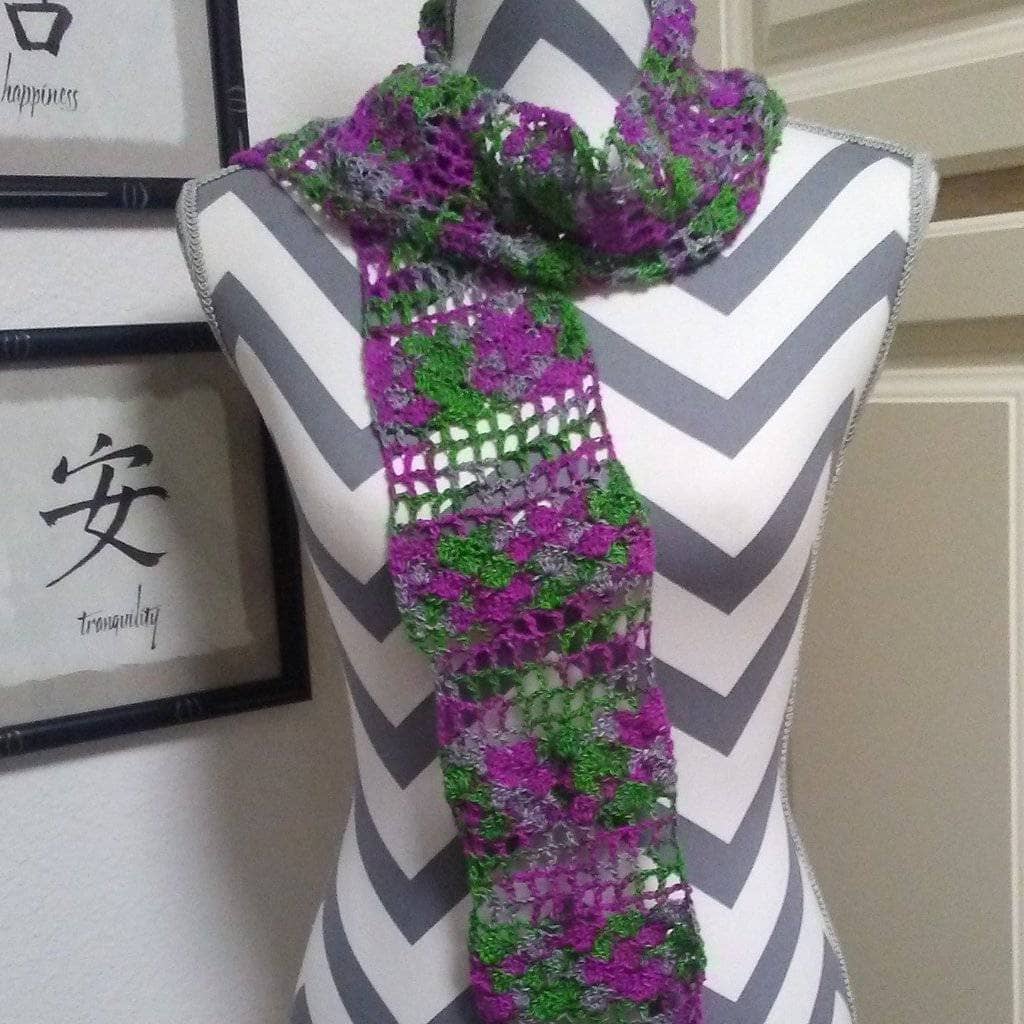 Colorful Shells on the Shoreline Silk Scarf laid flat to show the detailed crochet pattern.