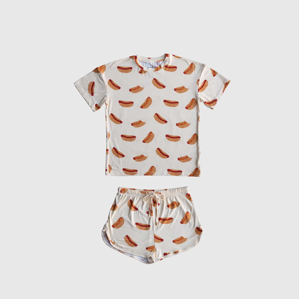 Girl wearing a two-piece bamboo short set with a colorful hot dog print