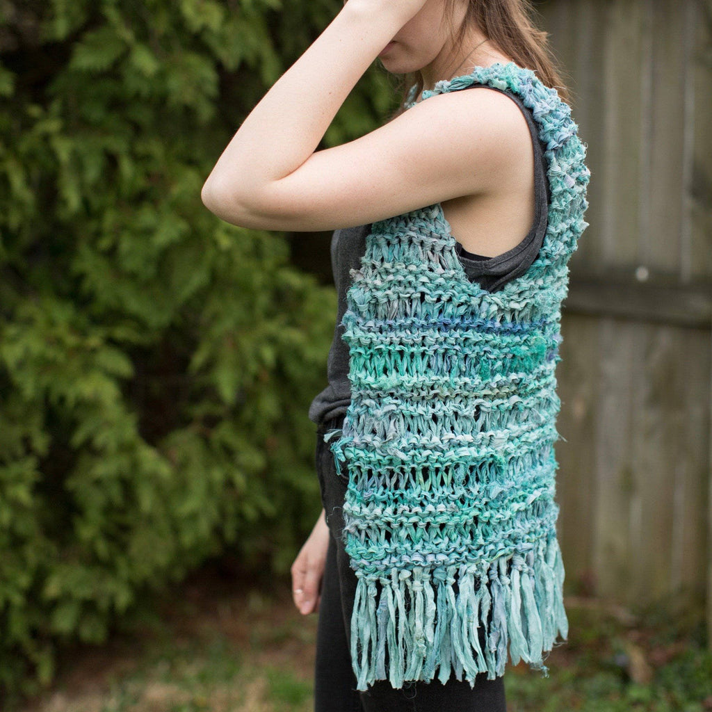 Boho-style fringe vest knitted from Sari Silk Ribbon shown in a festival setting