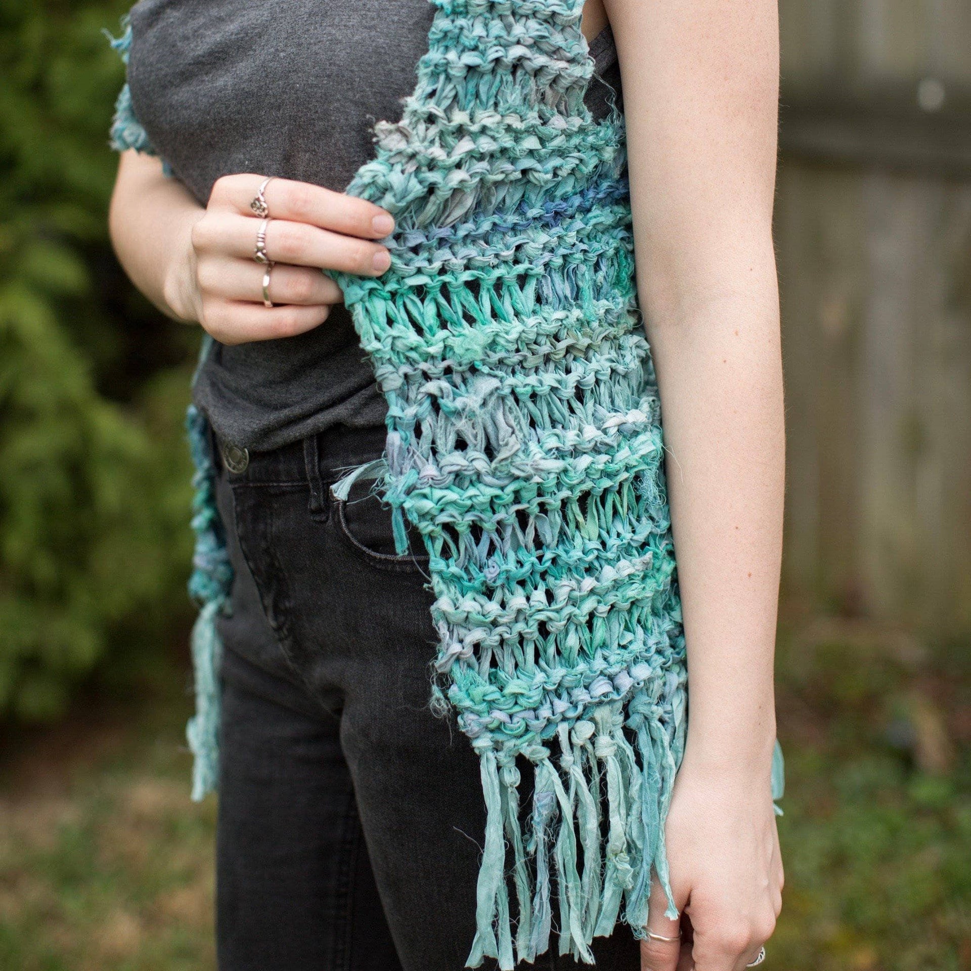 Close up of a vibrant Sari Silk Ribbon fringe vest from the Knit Kit collection