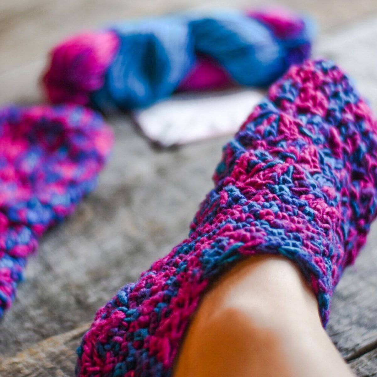Handmade Silk Mer-Slippers sitting on a soft surface, showcasing the crochet detail.