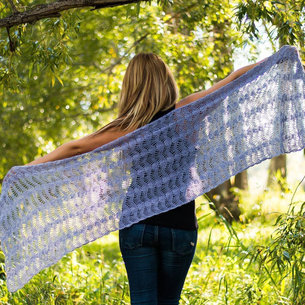 Close-up of a delicate lacy wave stitch shawl crochet pattern