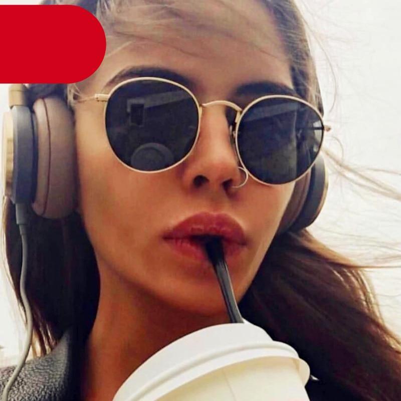 Round polarized sunglasses with black frames and UV400 protection for outdoor activities.