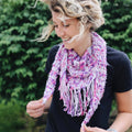Simple + Quick Banana Scarf Crochet Kit with purple, fuchsia, pink, and white variegated yarn.
