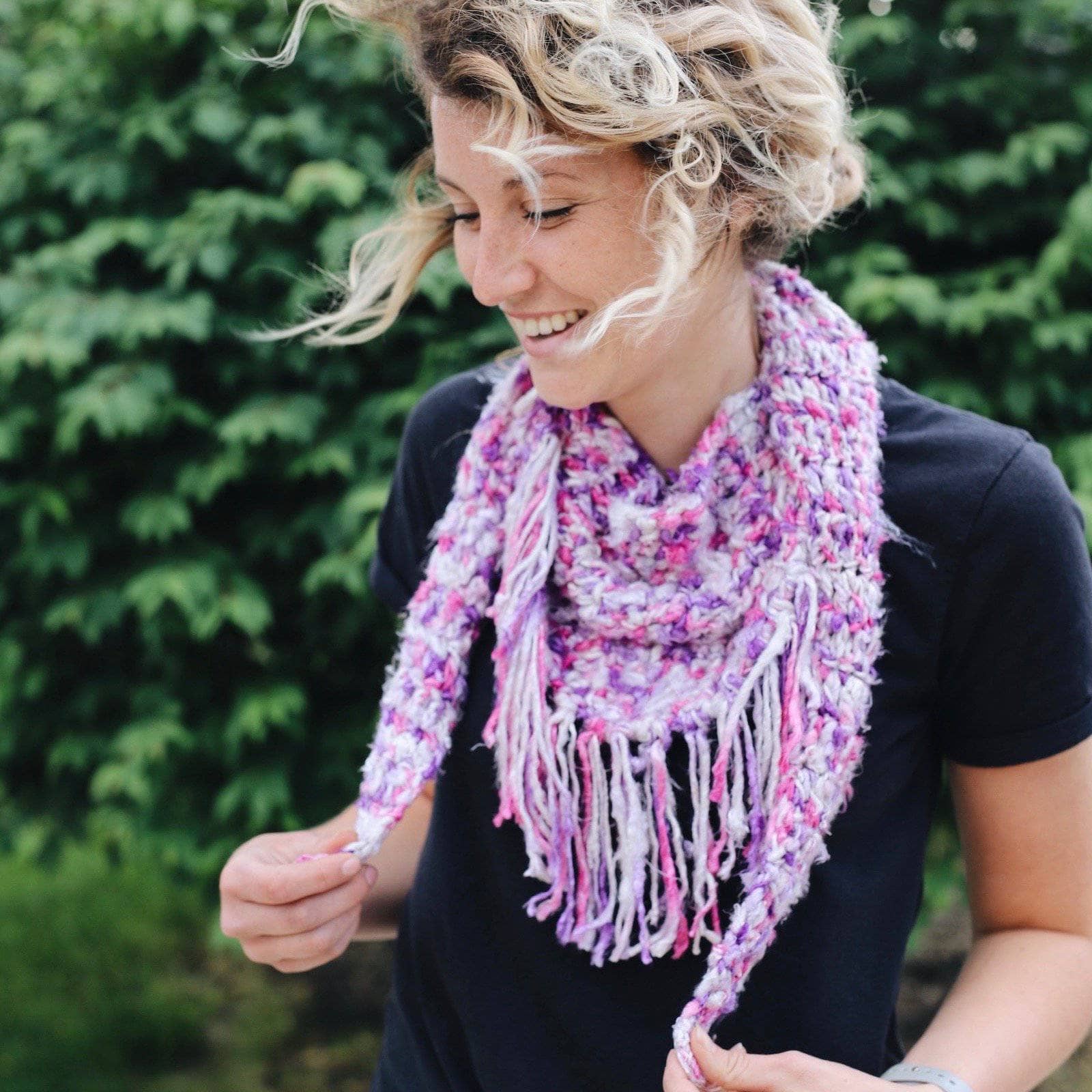 Simple + Quick Banana Scarf Crochet Kit with purple, fuchsia, pink, and white variegated yarn.