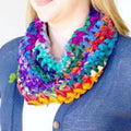 Simple Sari Cowl crochet pattern infinity scarf in a vibrant multi-color rainbow spectrum.