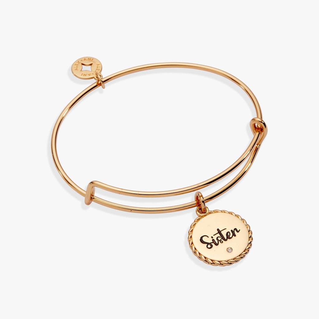Gold expandable charm bangle featuring a rope-edge texture and engraved Sister heart charm.