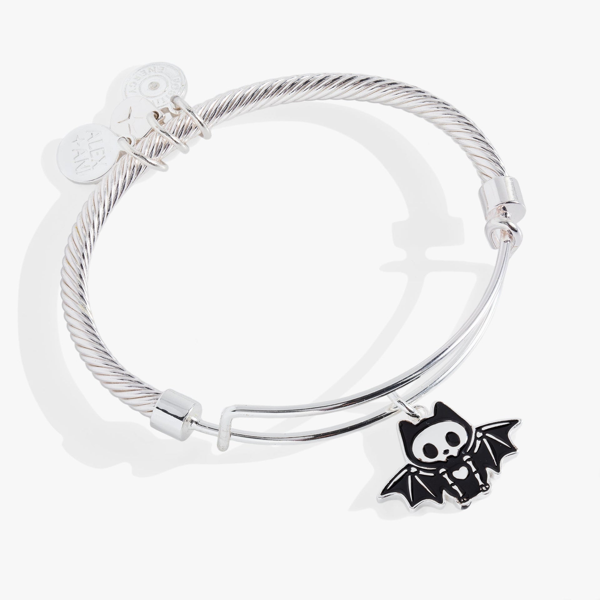 Silver-tone twisted wire bangle featuring a smiling bat skeleton charm with wings spread wide.