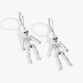 Modern polished silver skeleton drop earrings with articulated design and lever-back closure.
