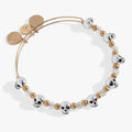 Skull beaded bangle bracelet with gold-tone spacing beads.