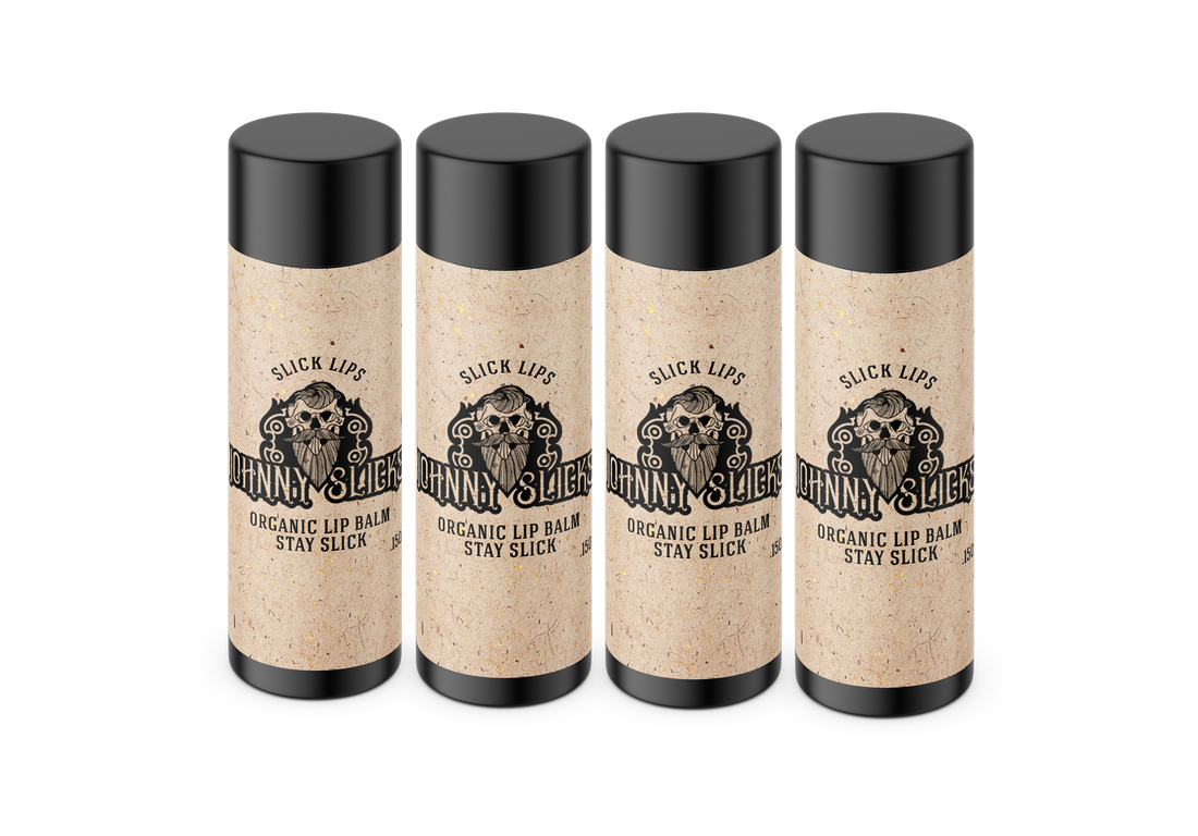 Four sticks of Johnny Slicks organic lip balm lined up on a white background