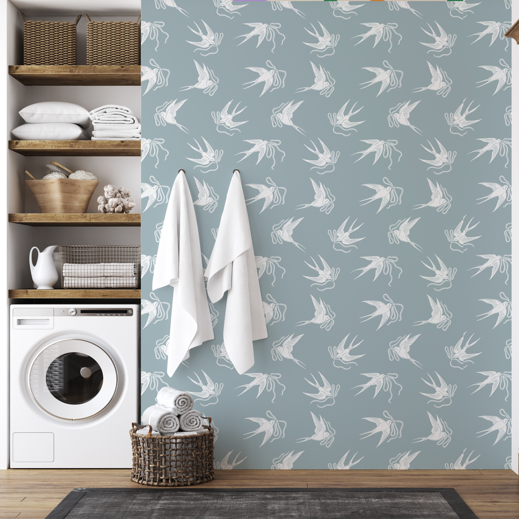Close up of Sloane vintage-inspired romantic wallpaper with blue-grey, sage-green, and pink floral patterns.
