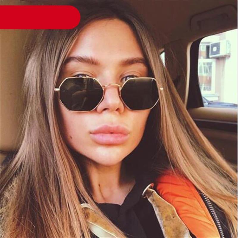Pair of delicate metal small polygon sunglasses in a retro style