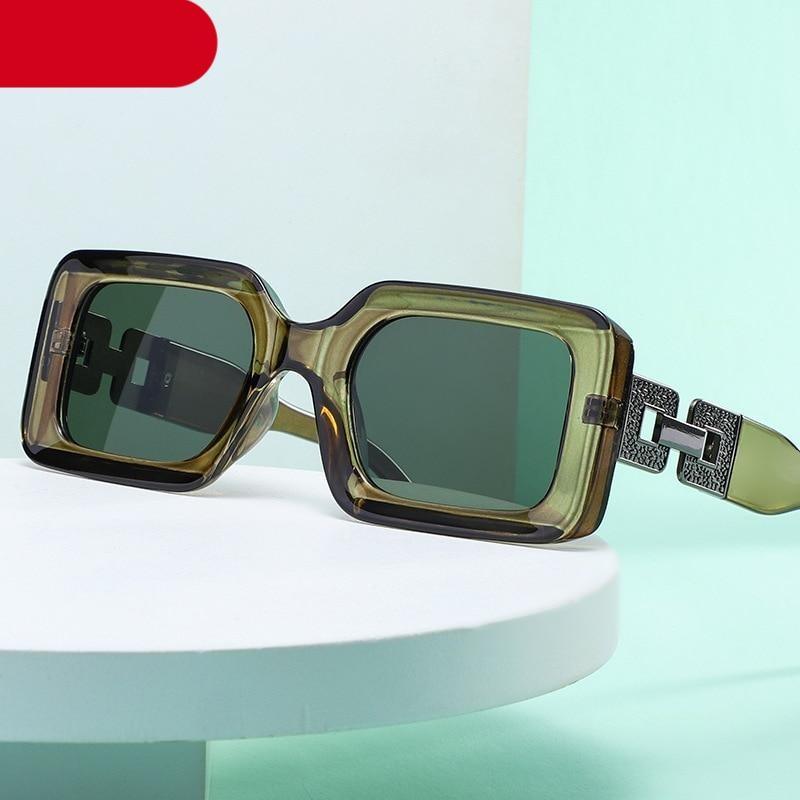 Model wearing vintage-style small rectangle sunglasses with a thick frame