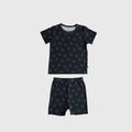 Child wearing a black and white smiley face ribbed bamboo crew neck short set