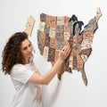 A 3D wooden map of the USA from the Smokey collection in brown, tan, and dark-blue tones.