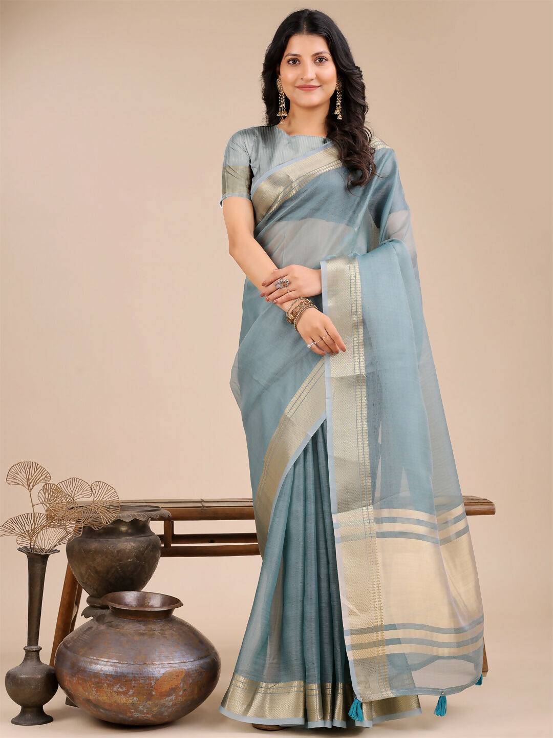 Seoul Sea Green Organza Saree showing the sheer fabric quality and color.