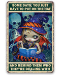 Decorative metal sign featuring a cartoon witch, skeletons, and the text Some Days, You Just Have to Put on the Hat