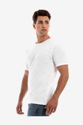 A man wearing a plain white short-sleeve crew neck t-shirt made in the USA