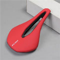 Modern black, white, and red cycling racing saddle showing the central channel design