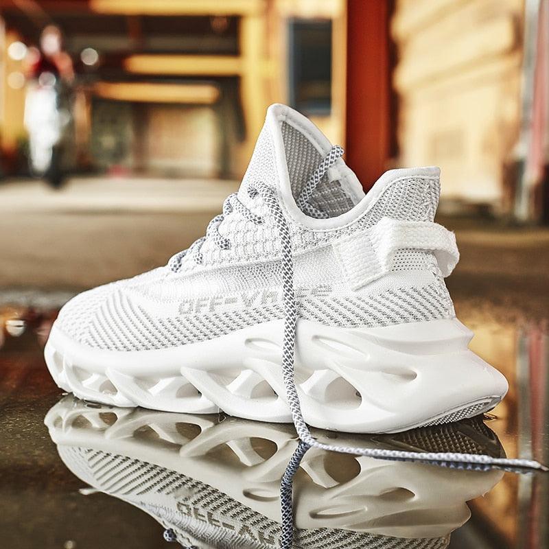 Men's white sneakers with innovative blade-style shock-absorbing outsole