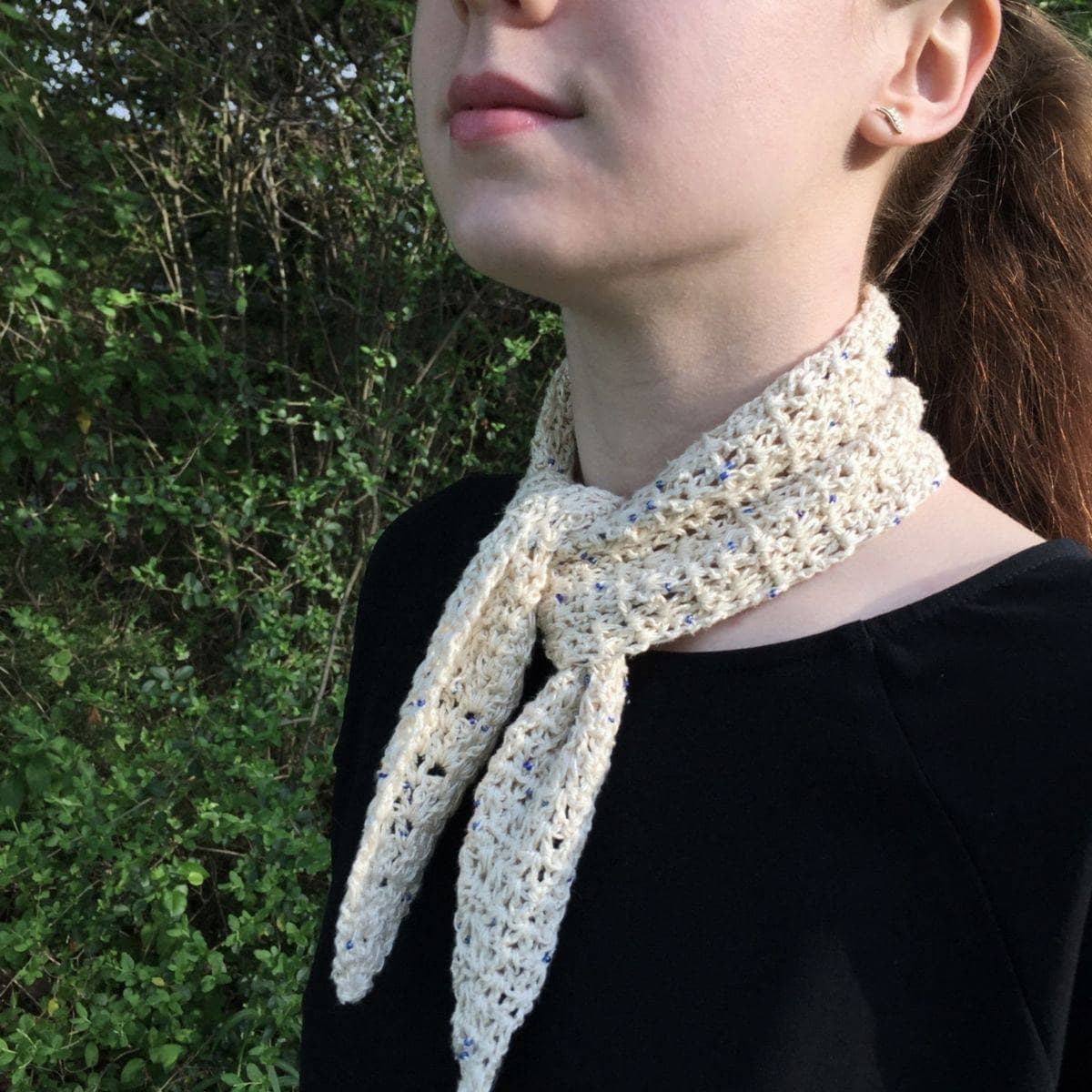 Springtime City Mini Crochet Scarf Kit featuring multi-colored yarn for a handcrafted accessory.