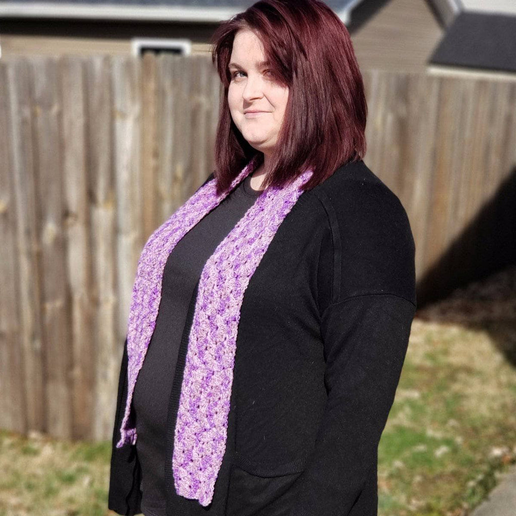 Springy Shells crochet scarf in a delicate shell stitch pattern worn over an outfit