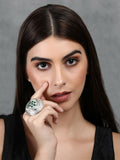 Handcrafted silver tone ring with intricate patterns and green stone setting