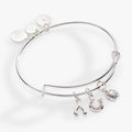 Silver expandable wire bangle featuring crystal-accented ladybug, horseshoe, and wishbone charms