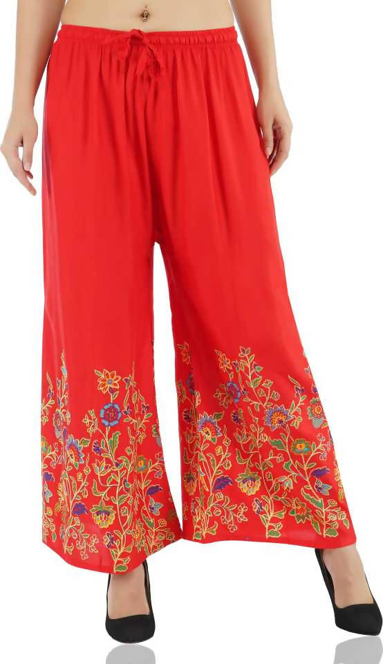 Red palazzo pants with vibrant floral print pattern
