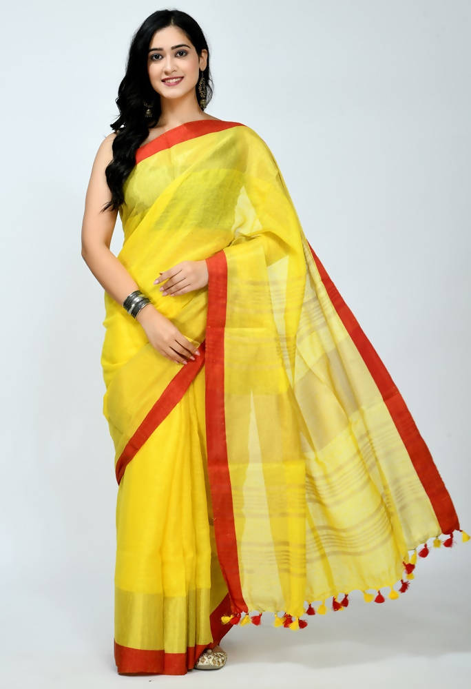 Bright yellow pure linen saree with a contrasting red blouse piece
