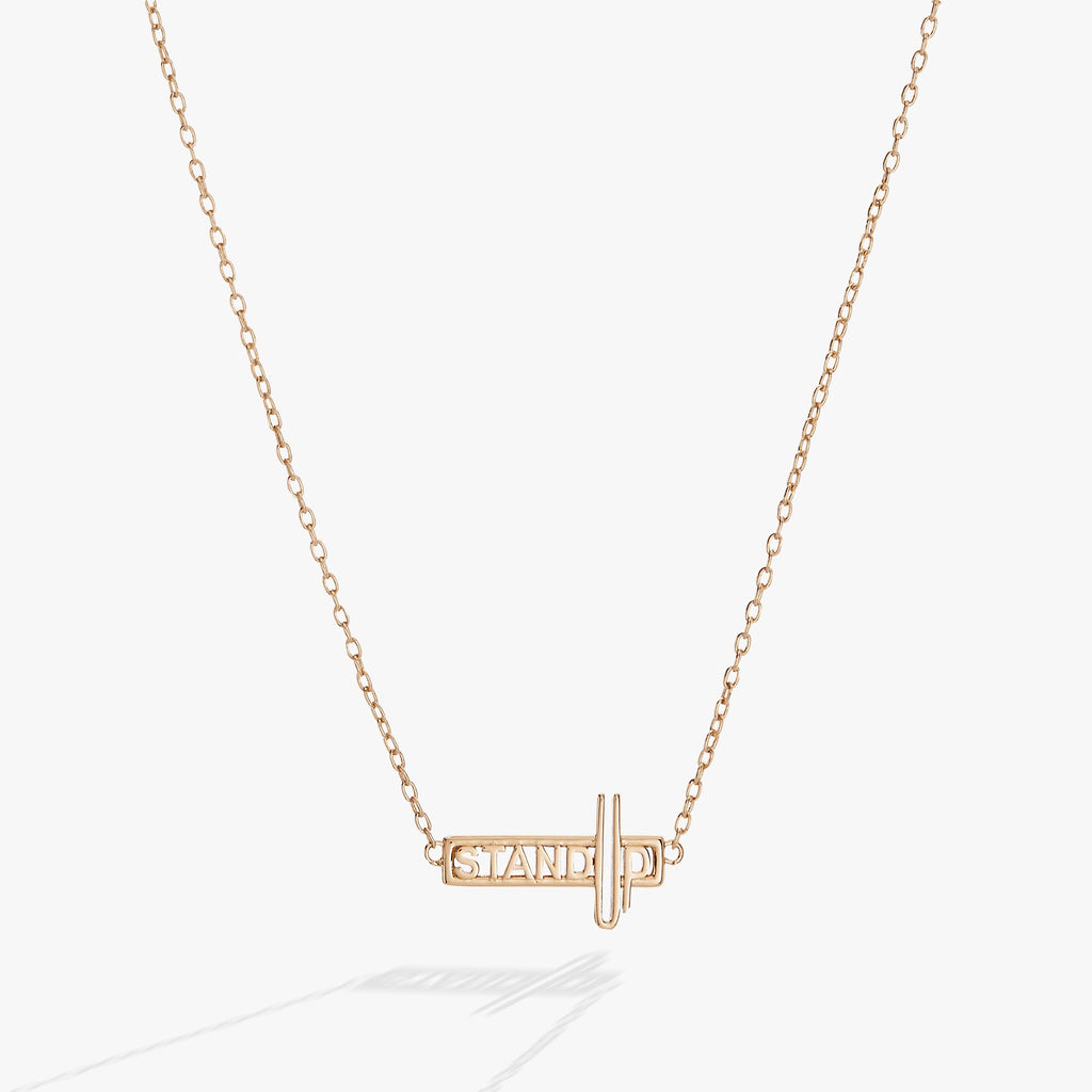Alex And Ani Stand Up pendant necklace on a delicate gold chain.