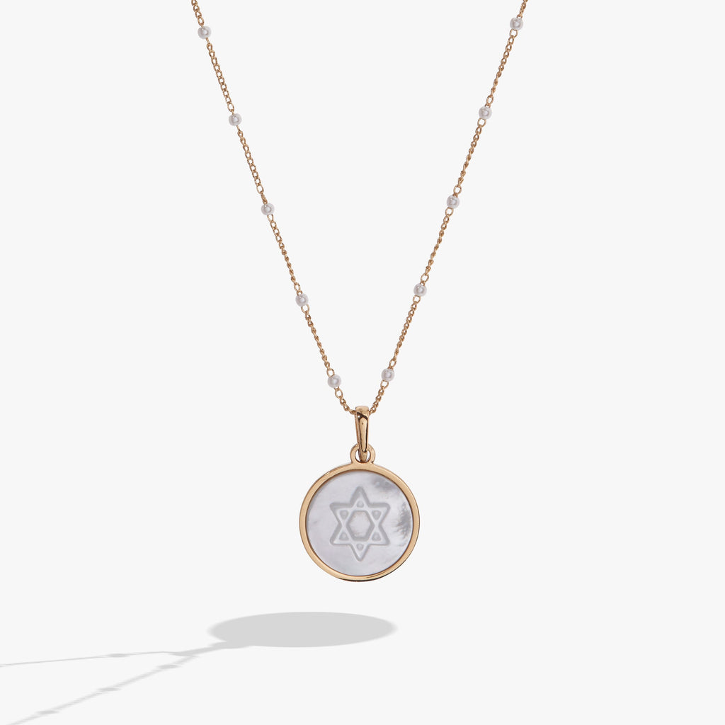 Gold toned Star of David pendant with Mother of Pearl and clear crystals on a delicate chain