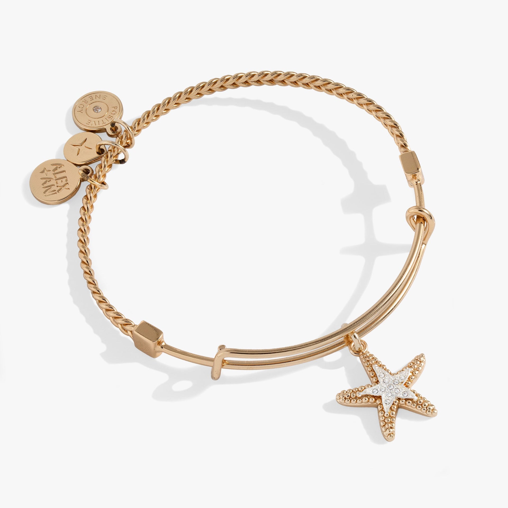 Gold-plated textured wire bangle featuring a two-tone silver and gold starfish charm with pavé crystal accents