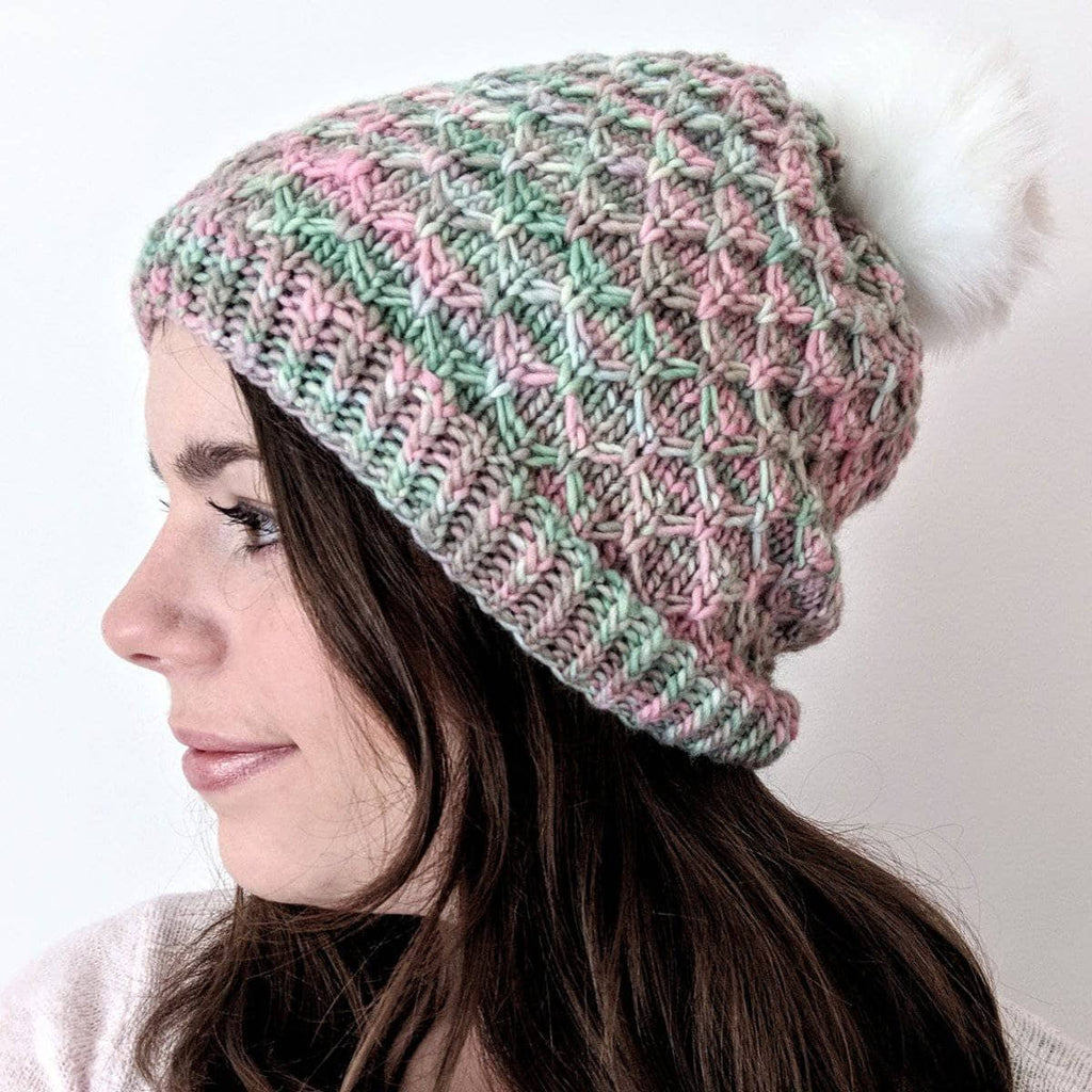 Storyteller Hat knitted from soft merino wool, shown as part of a DIY knitting kit.