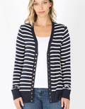 Close up of a navy and white striped snap-front cardigan with full sleeves.
