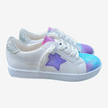 White PU leather sneakers with a colorful tie dye toe, purple glitter star, and silver glitter heel grip.