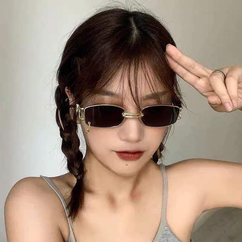 Trendy black square sunglasses with a classic metal frame.