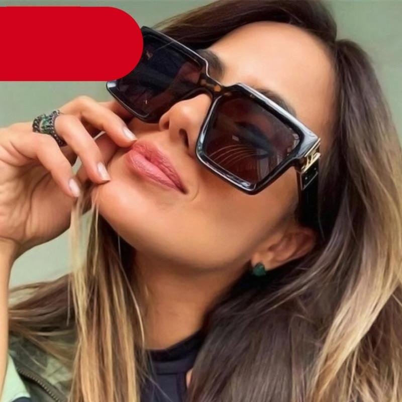 A pair of modern oversized square frame sunglasses in solid black, suitable for men and women.