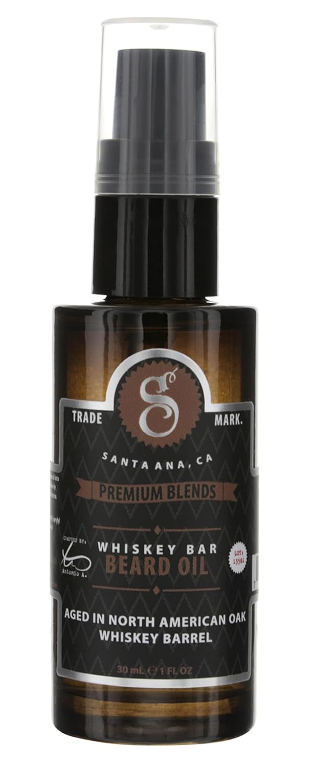 Amber bottle of Suavecito Beard Oil with metallic silver and black labeling.