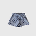 Close up of kids Sully navy and light blue polka dot board shorts