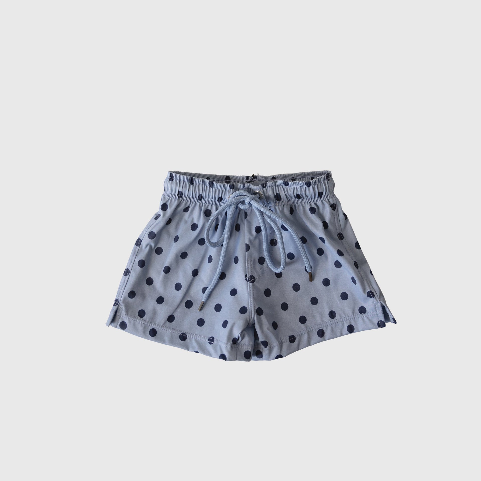 Close up of kids Sully navy and light blue polka dot board shorts