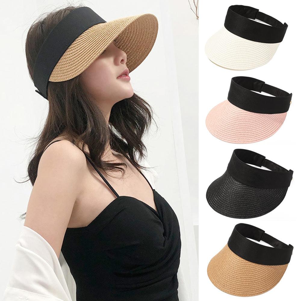 Foldable women's wide-brim empty-top sun hat in a retro style, shown in a portable design for beach and travel.