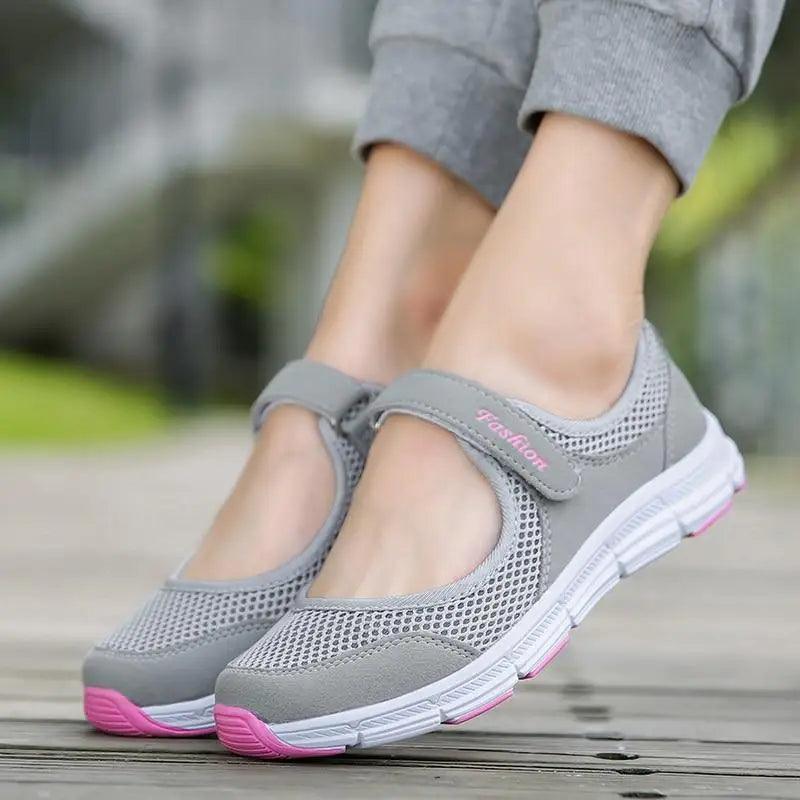 Women wearing breathable knit sport sneakers in neutral colors with hook-and-loop closure