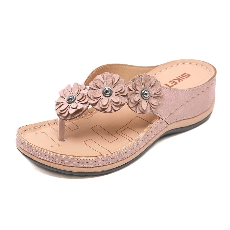 Close up of handmade retro floral leather flat sandals for women