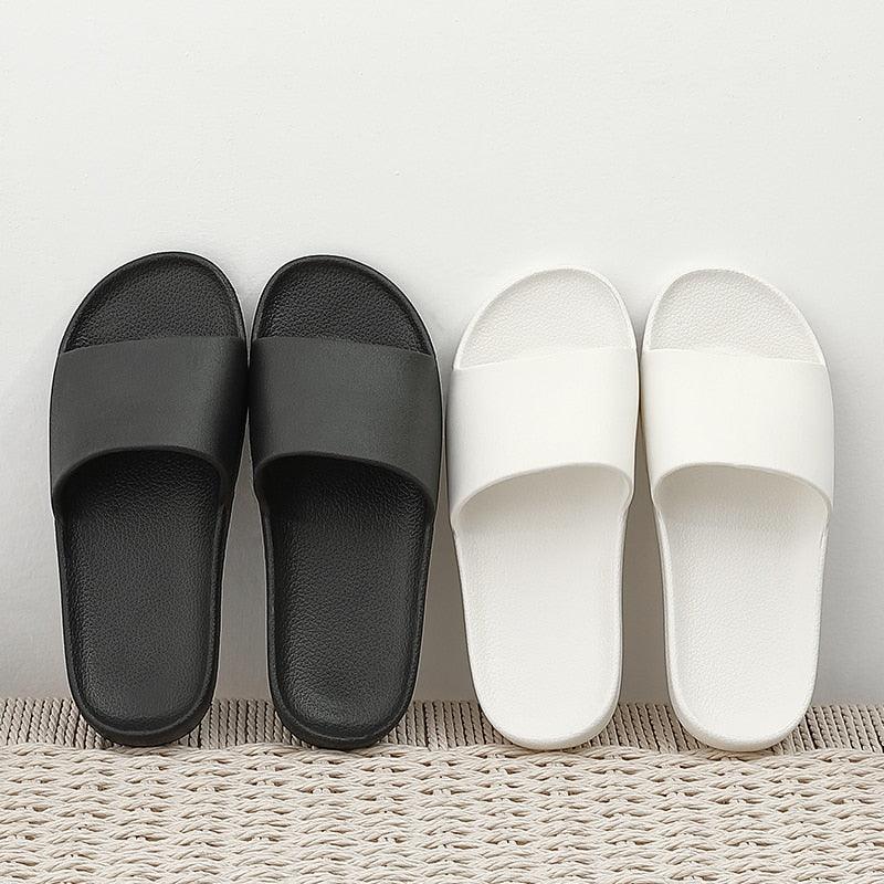 Unisex black and white cloud cushioned non-slip slides for home and pool use